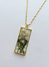 Gathered-in-the-Wild Botanical Necklace with real foraged flowers, mushrooms, pine needles, and leaves preserved in resin. Handcrafted wearable nature art by KStonely.