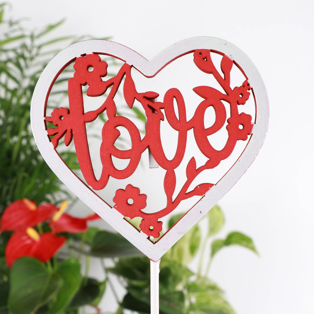 Wooden heart plant picks with built-in clip for cards or notes. Perfect finishing touch for houseplant gifts. Trim-to-fit 18" stake. No plants included.
