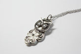 Handcrafted owl necklace made from vintage silverware. 1" pendant on 18" chain. Unique, upcycled jewelry with charm, symbolism, and timeless style.