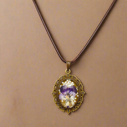 Palace Bloom Vintage Floral Necklace with real dried flowers in resin, antique-style pendant, and waxed rope chain. Lightweight, elegant, and one-of-a-kind.