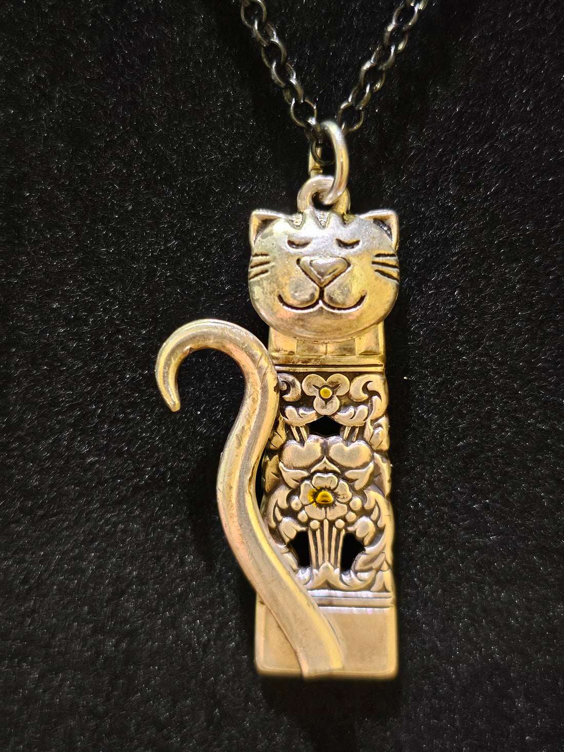 Handmade silver cat pendant necklaces from vintage silverware. Elegant, whimsical, and adjustable on a satin cord. Sustainably crafted and one-of-a-kind.