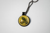 Handcrafted nature scene necklaces with real botanicals in iridescent and clear resin. Unique, wearable landscapes on chain or satin cord.