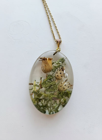 Gathered-in-the-Wild Botanical Necklace with real foraged flowers, mushrooms, pine needles, and leaves preserved in resin. Handcrafted wearable nature art by KStonely.