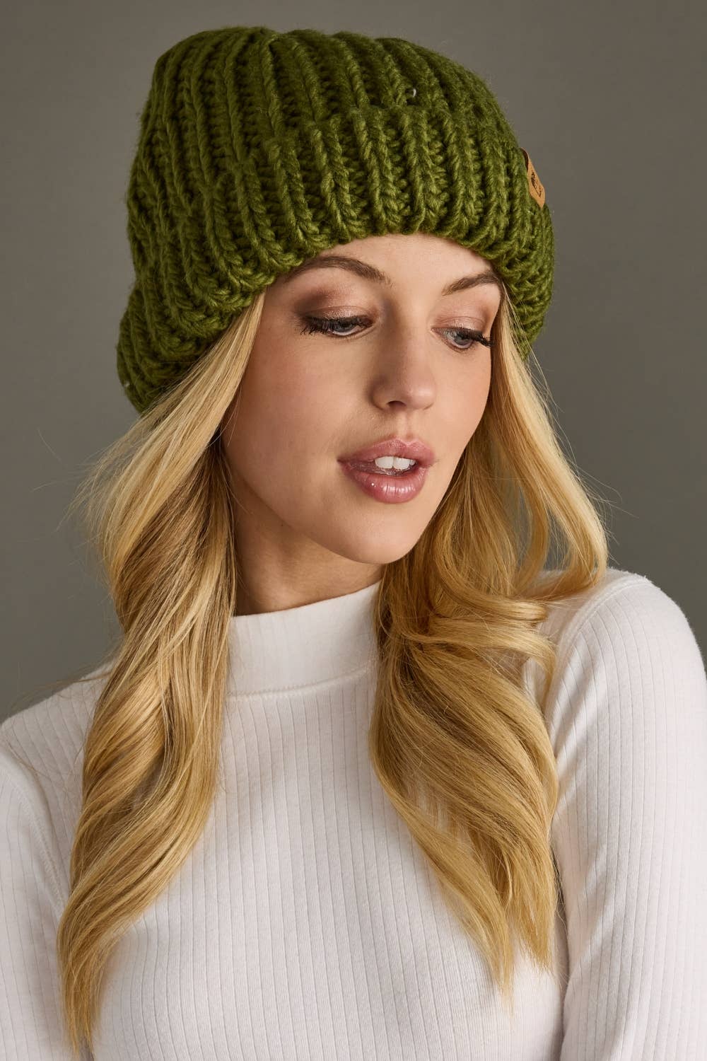 Olive chunky knit cuffed beanie with cozy fleece lining. Made from 100% acrylic, this classic winter hat adds warmth and earthy style to chilly days.