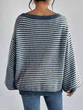 Cozy colorblocked striped one-shoulder knit sweater with relaxed fit and soft fabric. Wear off-shoulder or boat neck. Perfect for fall layering with denim or skirts.