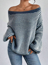 Cozy colorblocked striped one-shoulder knit sweater with relaxed fit and soft fabric. Wear off-shoulder or boat neck. Perfect for fall layering with denim or skirts.