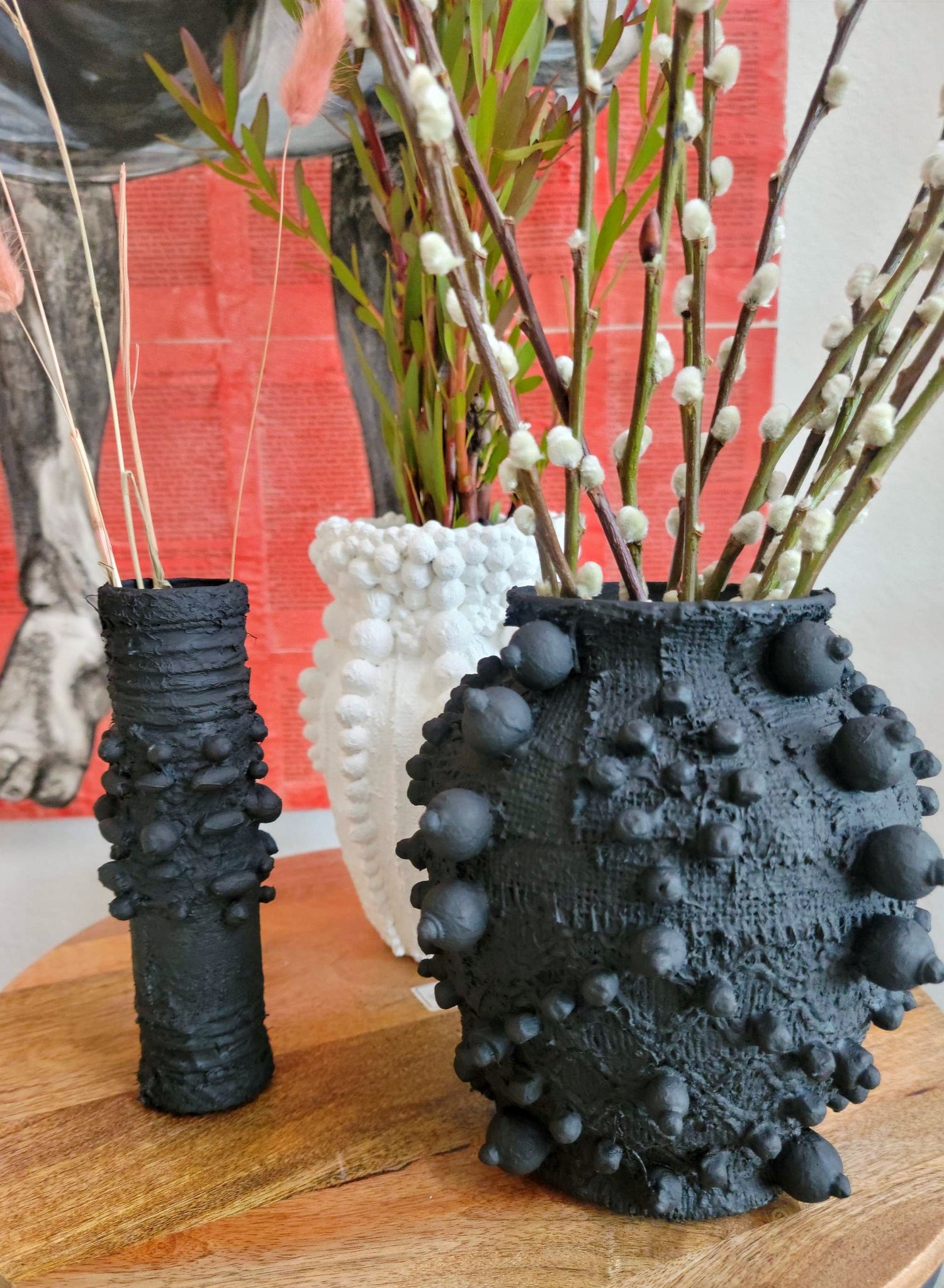 Elevate your decor with this handcrafted upcycled glass urn-shaped vase, made from reclaimed materials for a sustainable touch. Available in Glossy Black or Matte White, each unique piece offers artistic flair and eco-friendly style. Perfect for fresh or dried flowers, it suits both indoor and covered outdoor spaces.